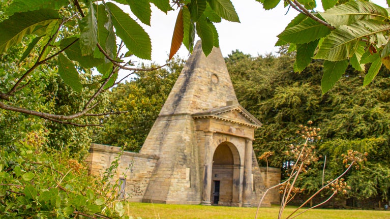 Obelisk lodge at Nostell with leaves in autumn colours
